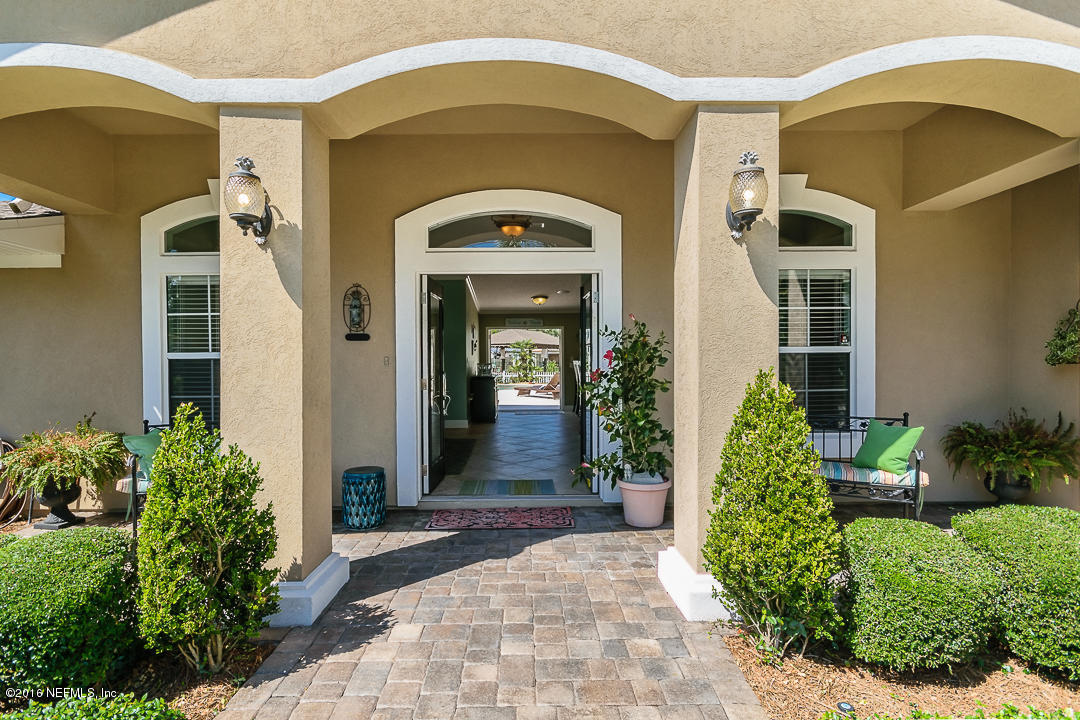 14446 Stacey Road Jacksonville, FL 32250 - Photo 5 of 31 a front view of a house with a porch
