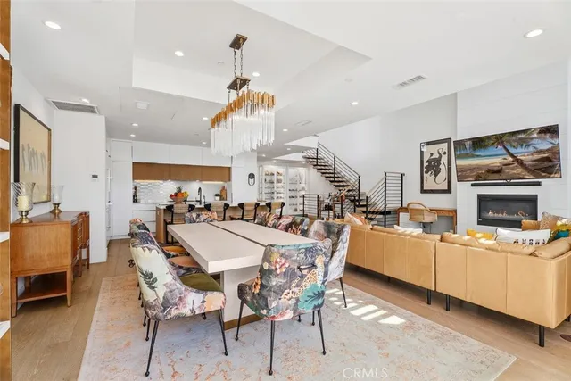 a large kitchen with a table and chairs