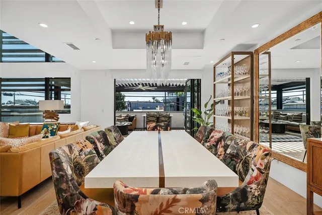 a living room with furniture window and wooden floor
