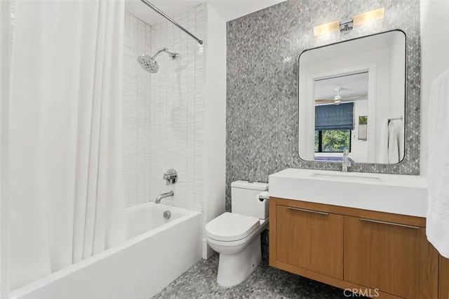 a view of a dining room with furniture one side kitchen view
