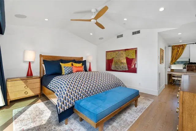 a bathroom with a sink mirror and vanity