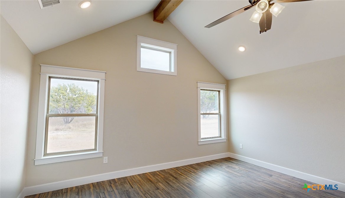 4219 Cool Basin Road Kempner, TX 76539 - Photo 16 of 25 a view of an empty room with wooden floor and window