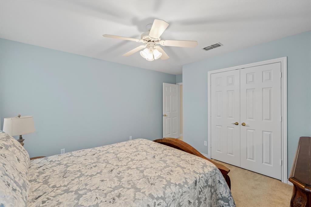 271 VZ County Road Canton, TX 75103 - Photo 28 of 40 a bedroom with a bed and a chandelier