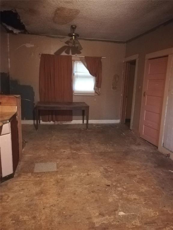 457 West Main Street Ranger, TX 76470 - Photo 7 of 9 a view of room with window and hardwood