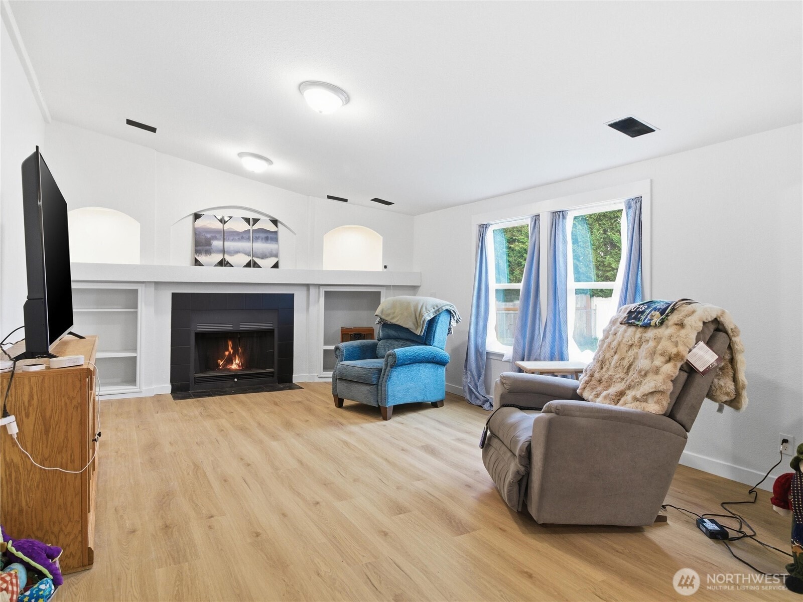 15429 107th Loop Southeast Yelm, WA 98597 - Photo 13 of 29 a living room with furniture and a fireplace