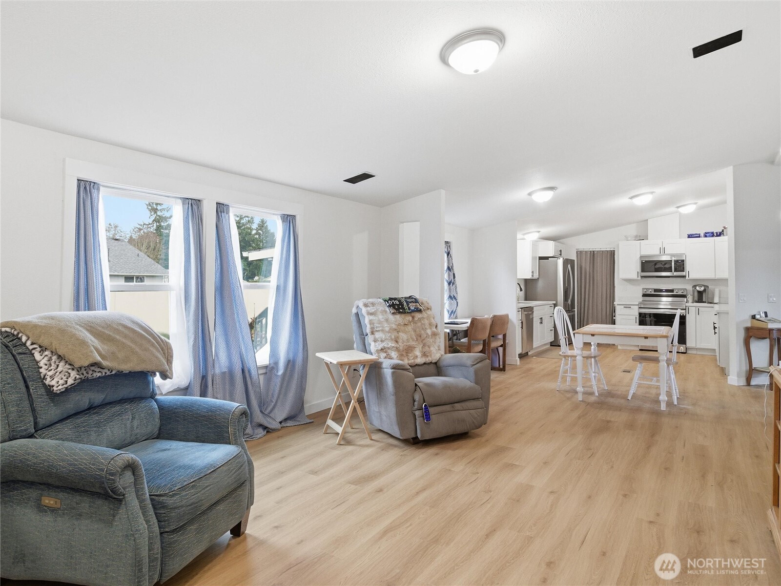 15429 107th Loop Southeast Yelm, WA 98597 - Photo 15 of 29 a living room with furniture and a large window