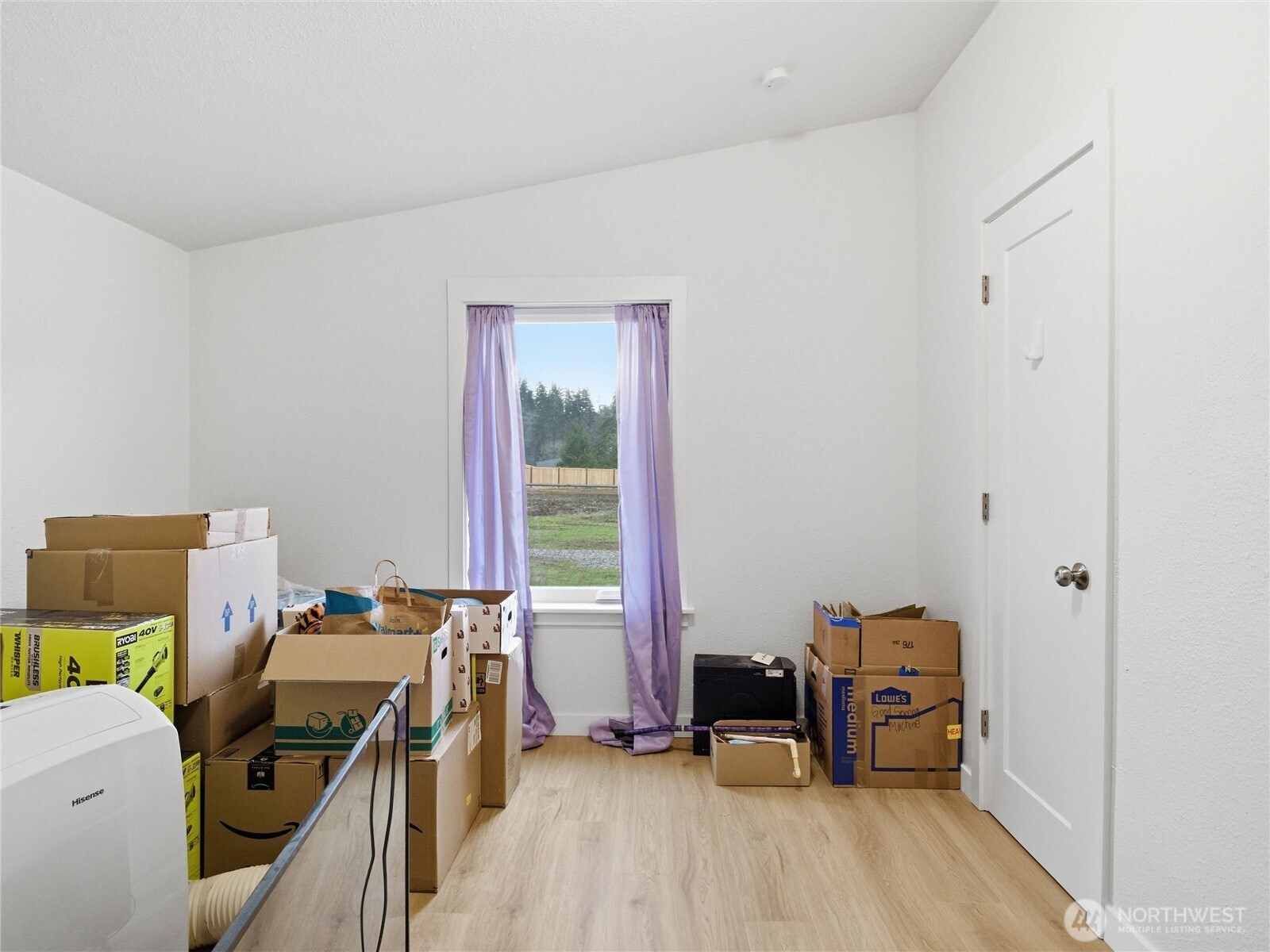 15429 107th Loop Southeast Yelm, WA 98597 - Photo 21 of 29 a view of a workspace with furniture and a gate