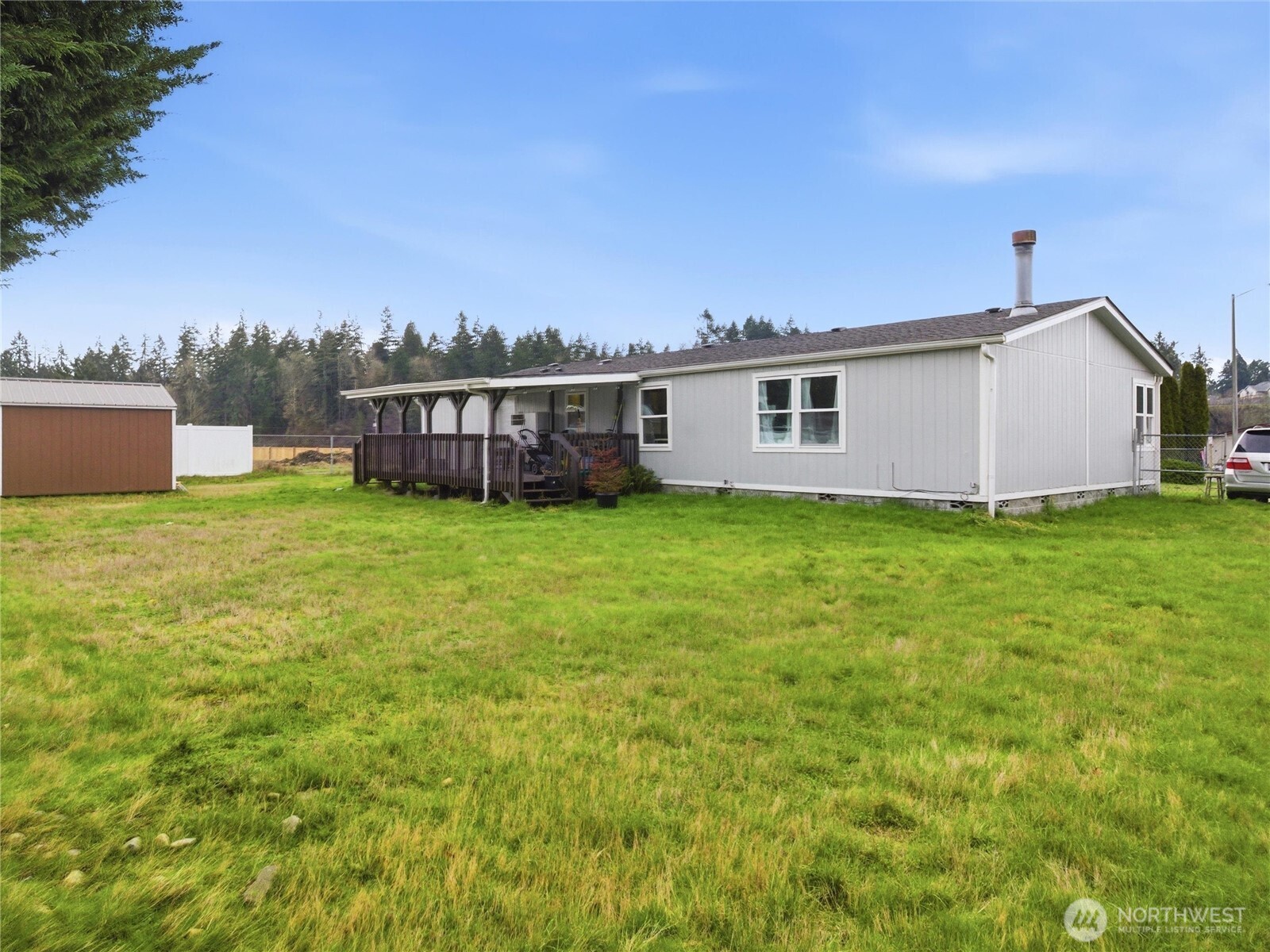 15429 107th Loop Southeast Yelm, WA 98597 - Photo 23 of 29 a view of a house with a yard and sitting area