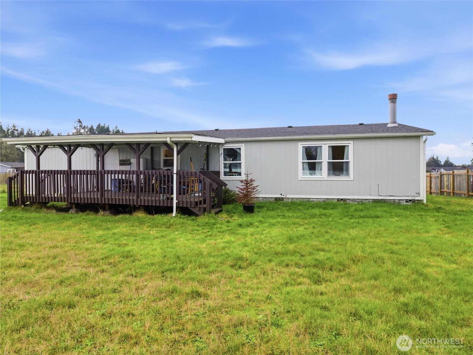 15429 107th Loop Southeast Yelm, WA 98597 - Photo 24 of 29 a view of a house with a backyard