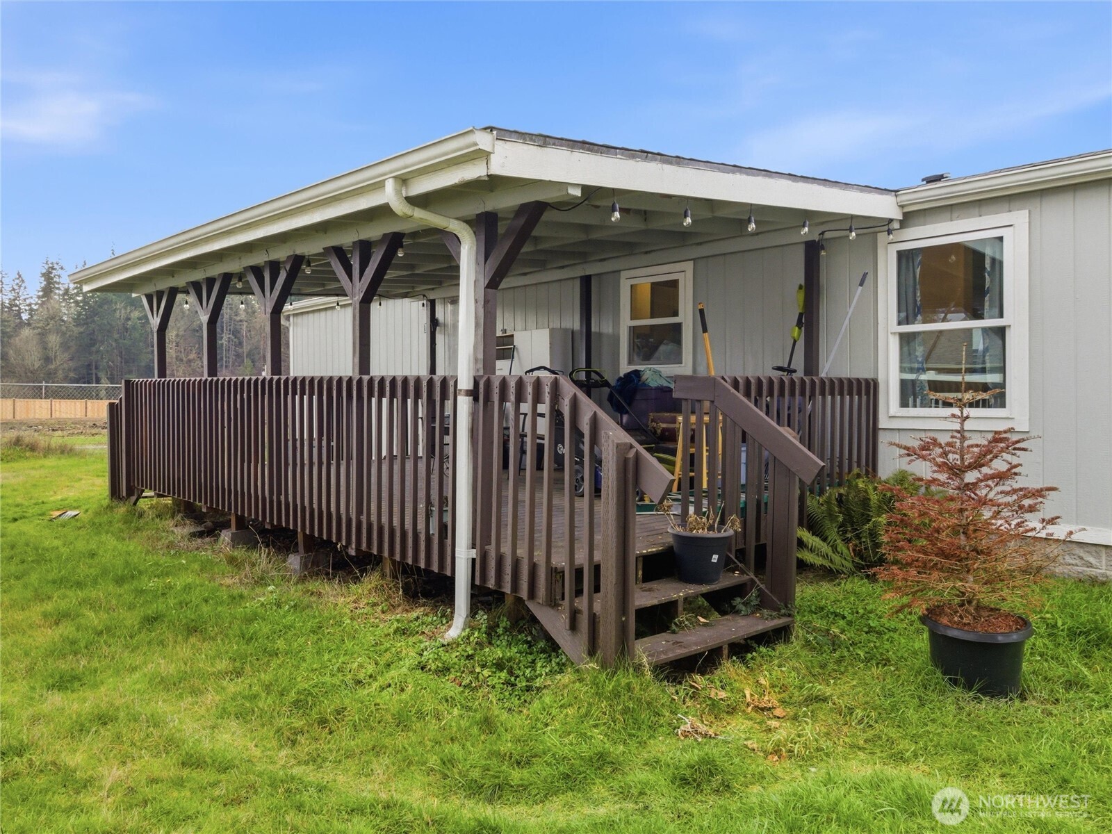 15429 107th Loop Southeast Yelm, WA 98597 - Photo 25 of 29 a view of a house with a yard and deck