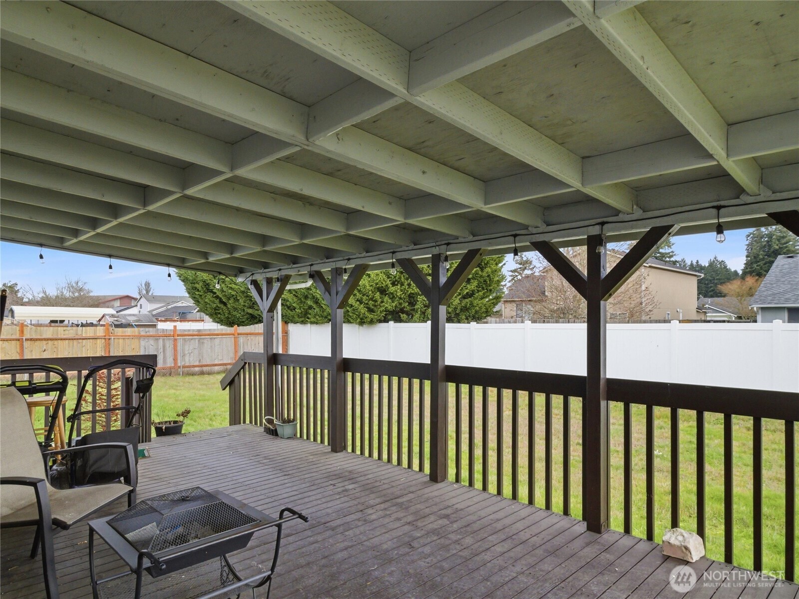 15429 107th Loop Southeast Yelm, WA 98597 - Photo 26 of 29 a porch with a table and chairs