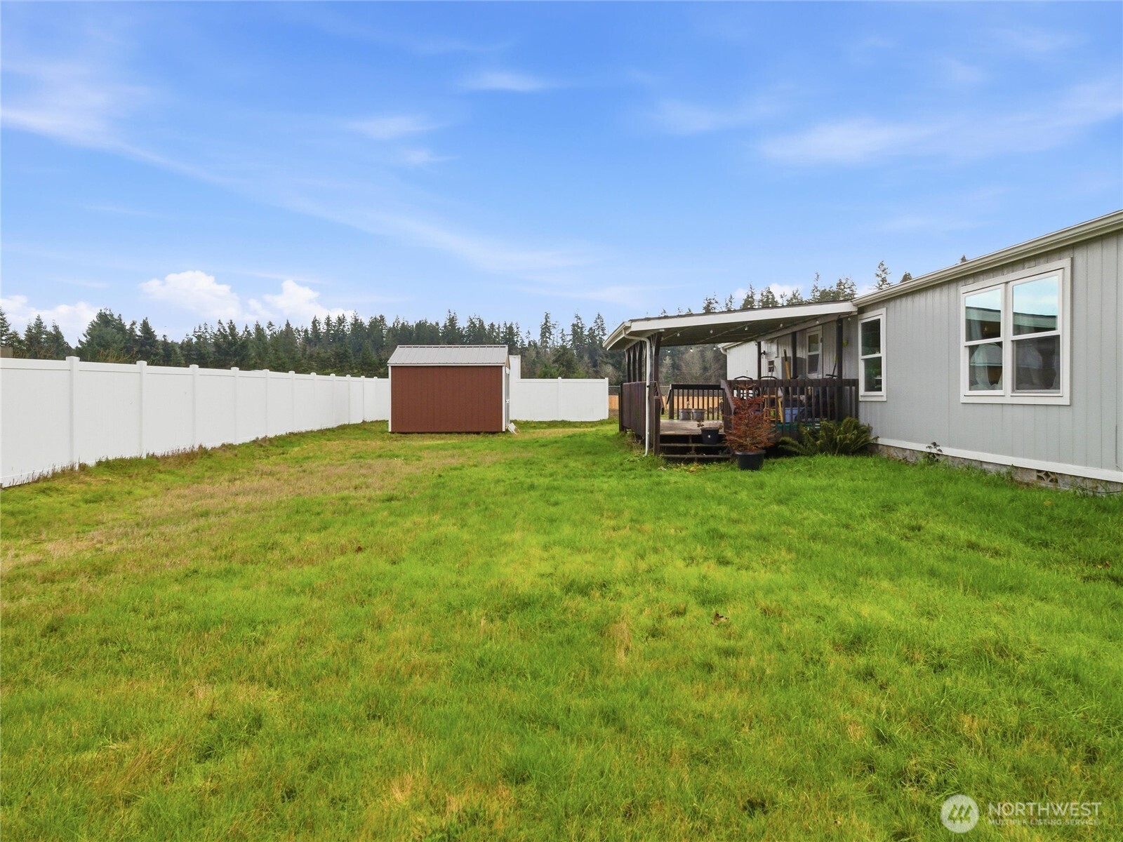 15429 107th Loop Southeast Yelm, WA 98597 - Photo 27 of 29 a view of a house with a yard and sitting area