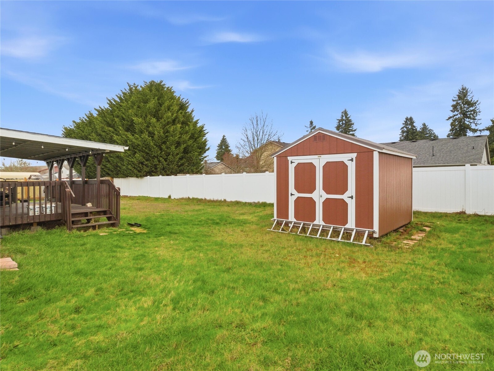 15429 107th Loop Southeast Yelm, WA 98597 - Photo 28 of 29 a view of a house with a backyard