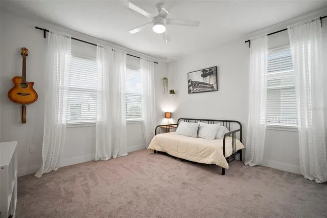 a bed room with a bed and a window