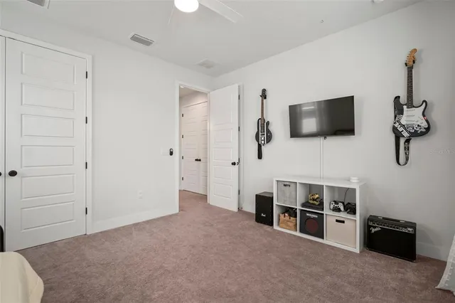 a view of a livingroom with furniture and flat screen tv