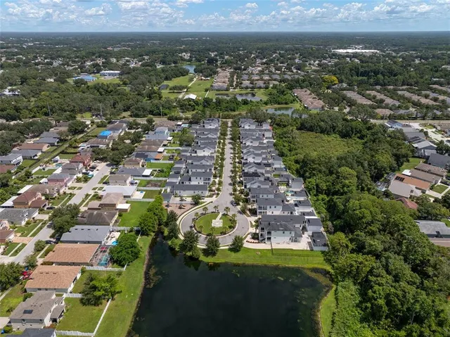 an aerial view of residential building and trees