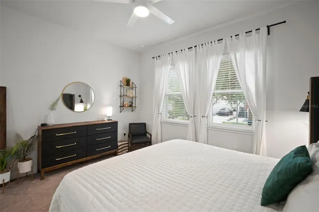 a bedroom with a bed and a dresser