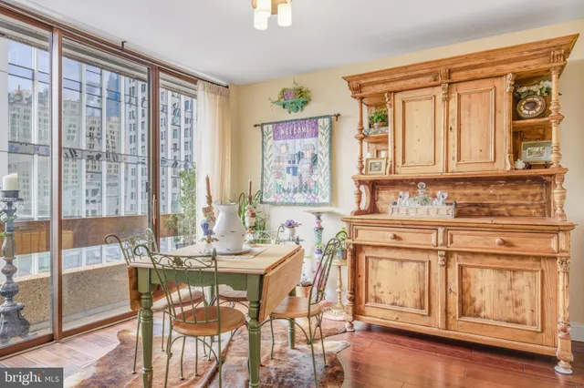a view of a dining room with furniture window and wooden floor