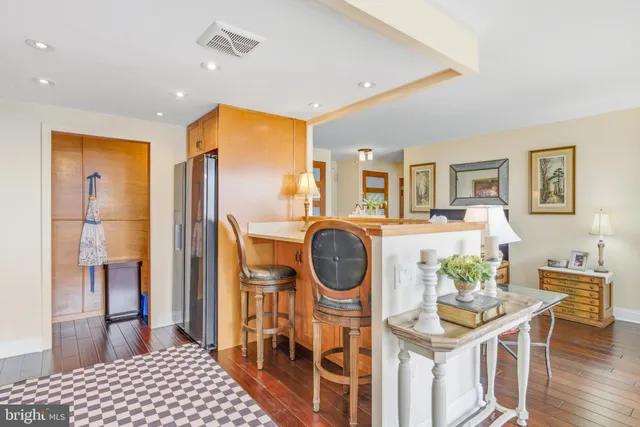 a kitchen with stainless steel appliances a stove a sink and a microwave