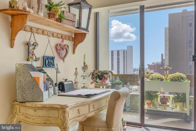 a view of a dining room with furniture and a window