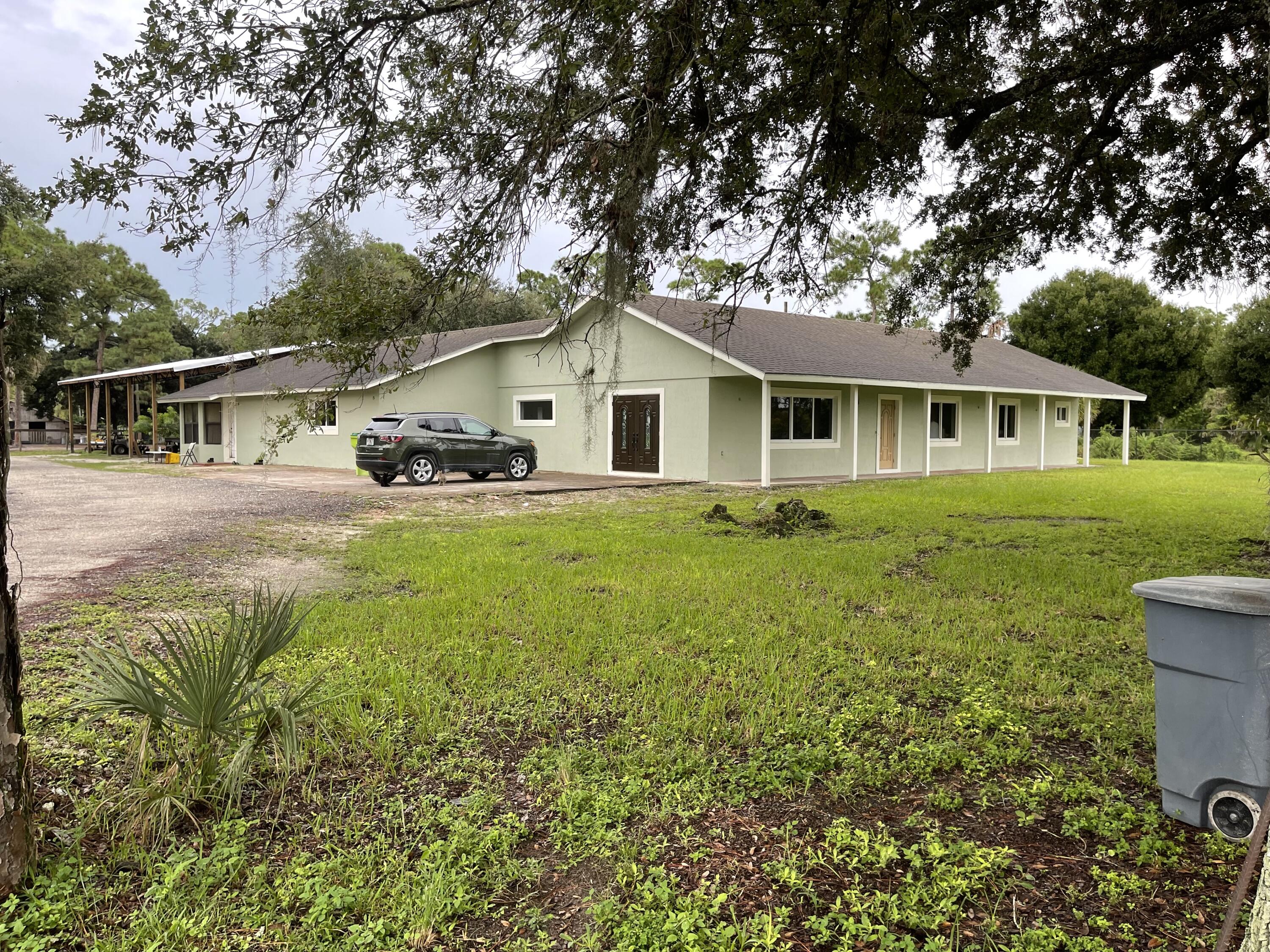 12667 Kazee Road Loxahatchee Groves, FL 33470 - Photo 1 of 22 Front