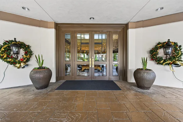 a bathroom with a granite countertop sink and a large mirror