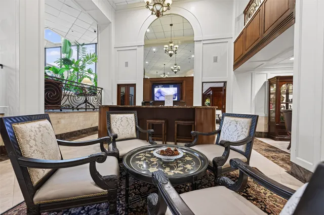 a kitchen with stainless steel appliances granite countertop a sink a stove and a wooden floors