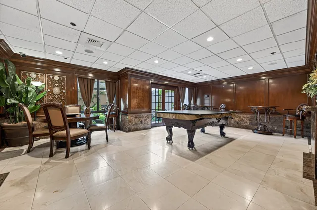 a kitchen with granite countertop a refrigerator a sink and a stove