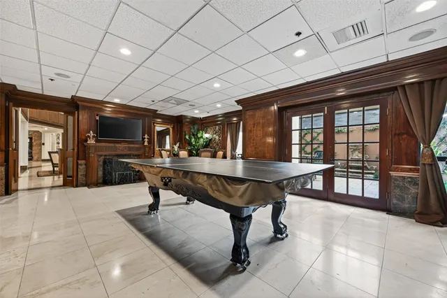 a view of a kitchen with a refrigerator a sink and wooden floor