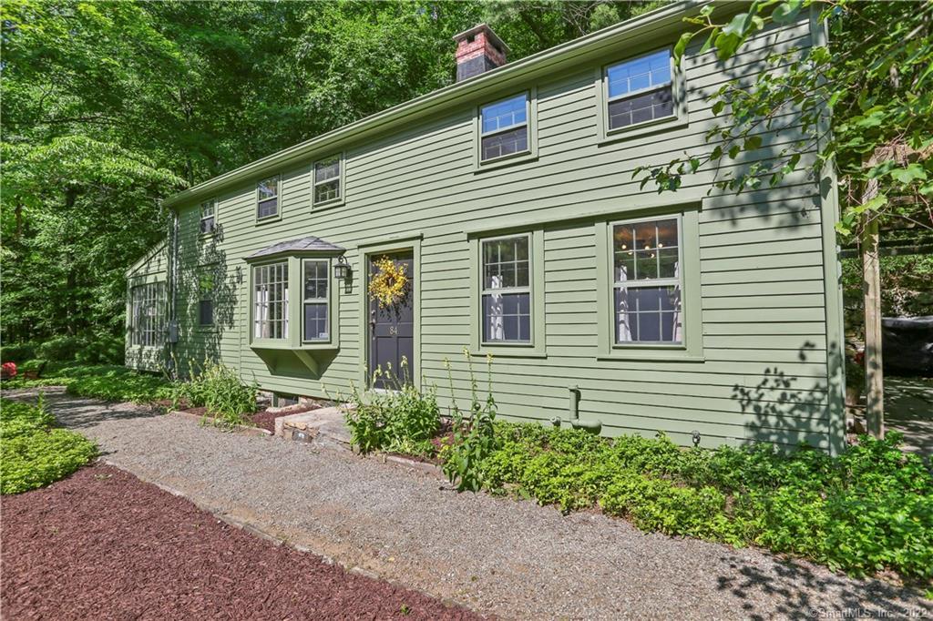 84 West Mountain Road Ridgefield, CT 06877 - Photo 1 of 1 a view of a house with a yard and potted plants
