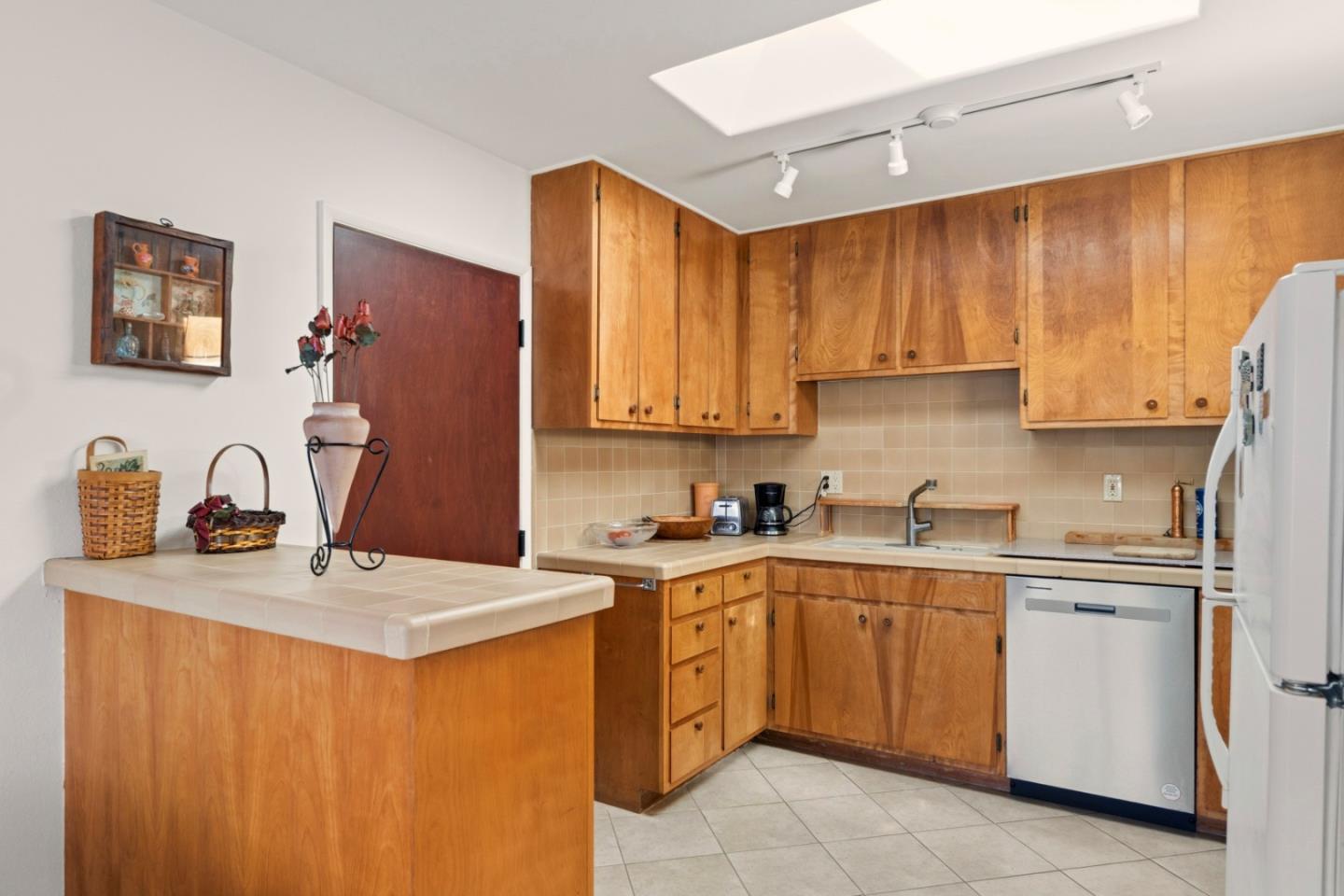 1313 Harding Street Seaside, CA 93955 - Photo 11 of 26 a kitchen with stainless steel appliances granite countertop a sink stove refrigerator and cabinets