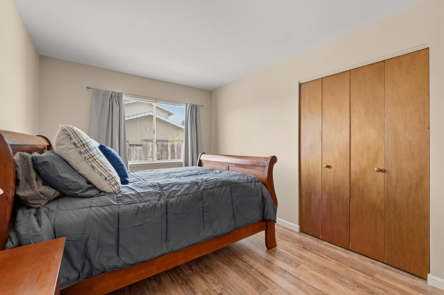 1313 Harding Street Seaside, CA 93955 - Photo 14 of 26 a bed sitting in a bedroom next to a window