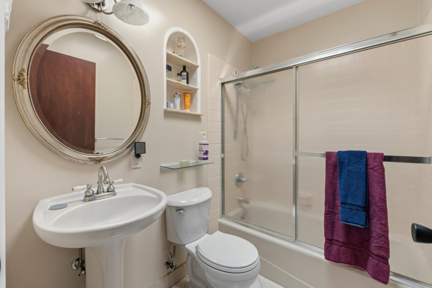 1313 Harding Street Seaside, CA 93955 - Photo 19 of 26 a bathroom with a sink a toilet and a mirror