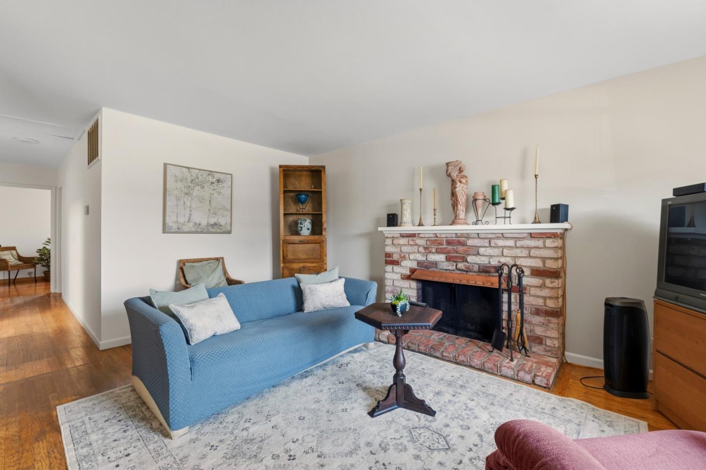 1313 Harding Street Seaside, CA 93955 - Photo 6 of 26 a living room with furniture a fireplace and a flat screen tv