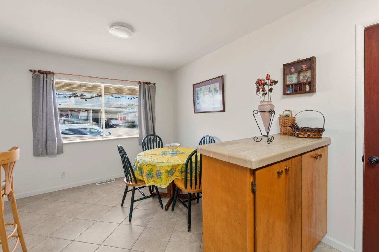 1313 Harding Street Seaside, CA 93955 - Photo 9 of 26 a view of a dining room with furniture and a window