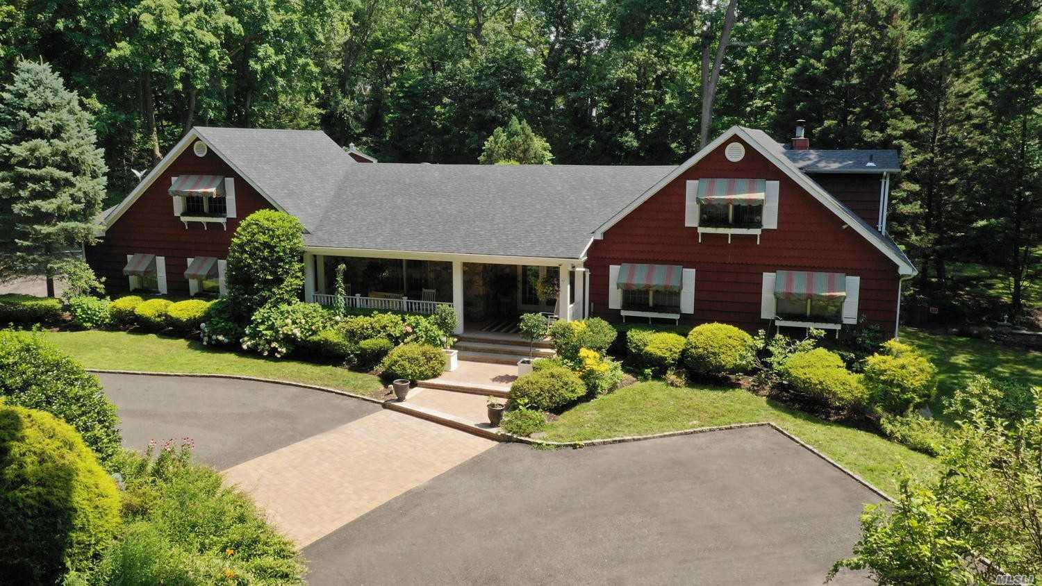 3 Forest Drive Sands Point, NY 11050 - Photo 1 of 1 a front view of a house with a yard and potted plants