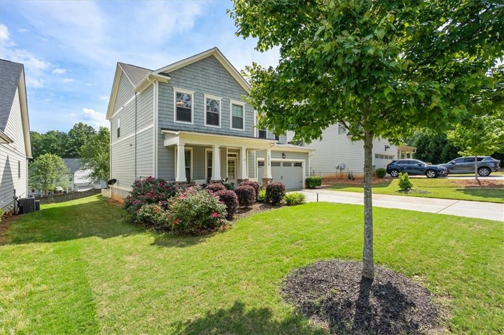 1715 Dyeson Road Southwest Marietta, GA 30008 - Photo 1 of 1 a view of a house with backyard and sitting area