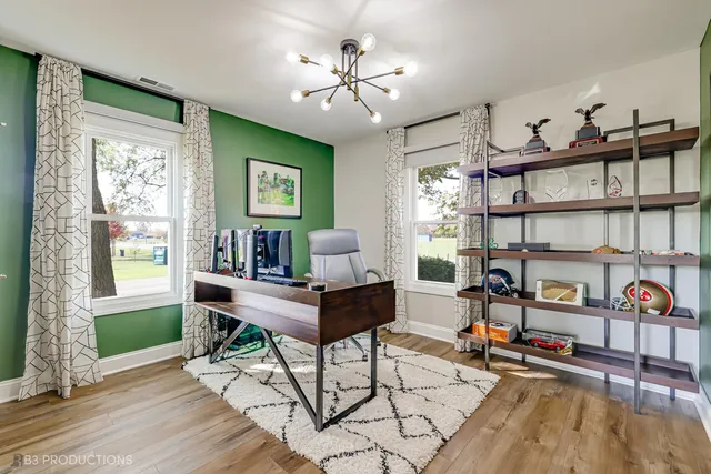 a work room with furniture and a window