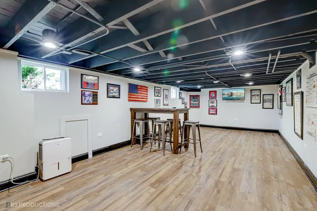 a view of a room with wooden furniture and a kitchen