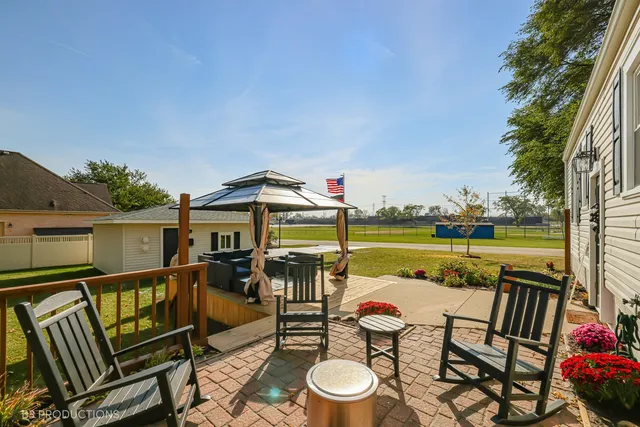 swimming pool view with a seating space
