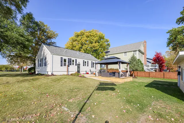 a house view with a sitting space and garden