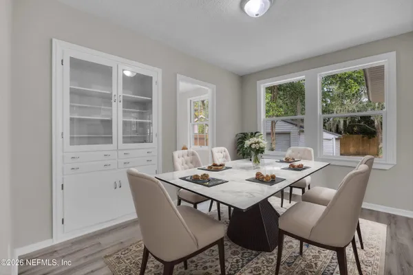 a view of a dining room with furniture window and outside view