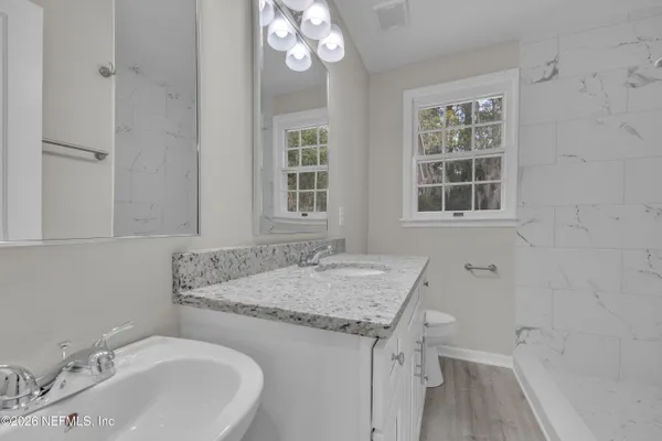 a bathroom with a sink and a bathtub