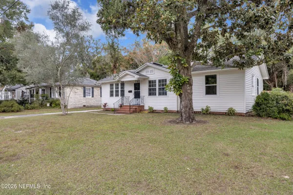 front view of a house with a yard