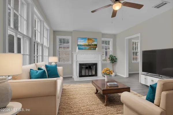 a living room with furniture and a fireplace
