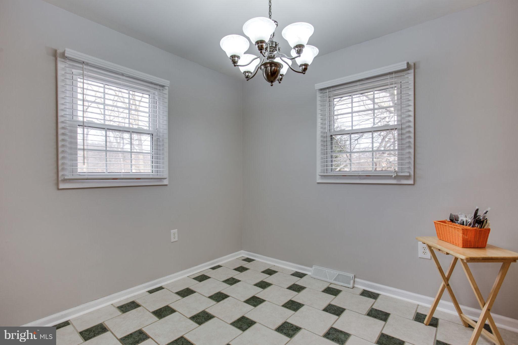 1625 Thomas Drive Point of Rocks, MD 21777 - Photo 13 of 47 a bedroom with a bed and a chandelier