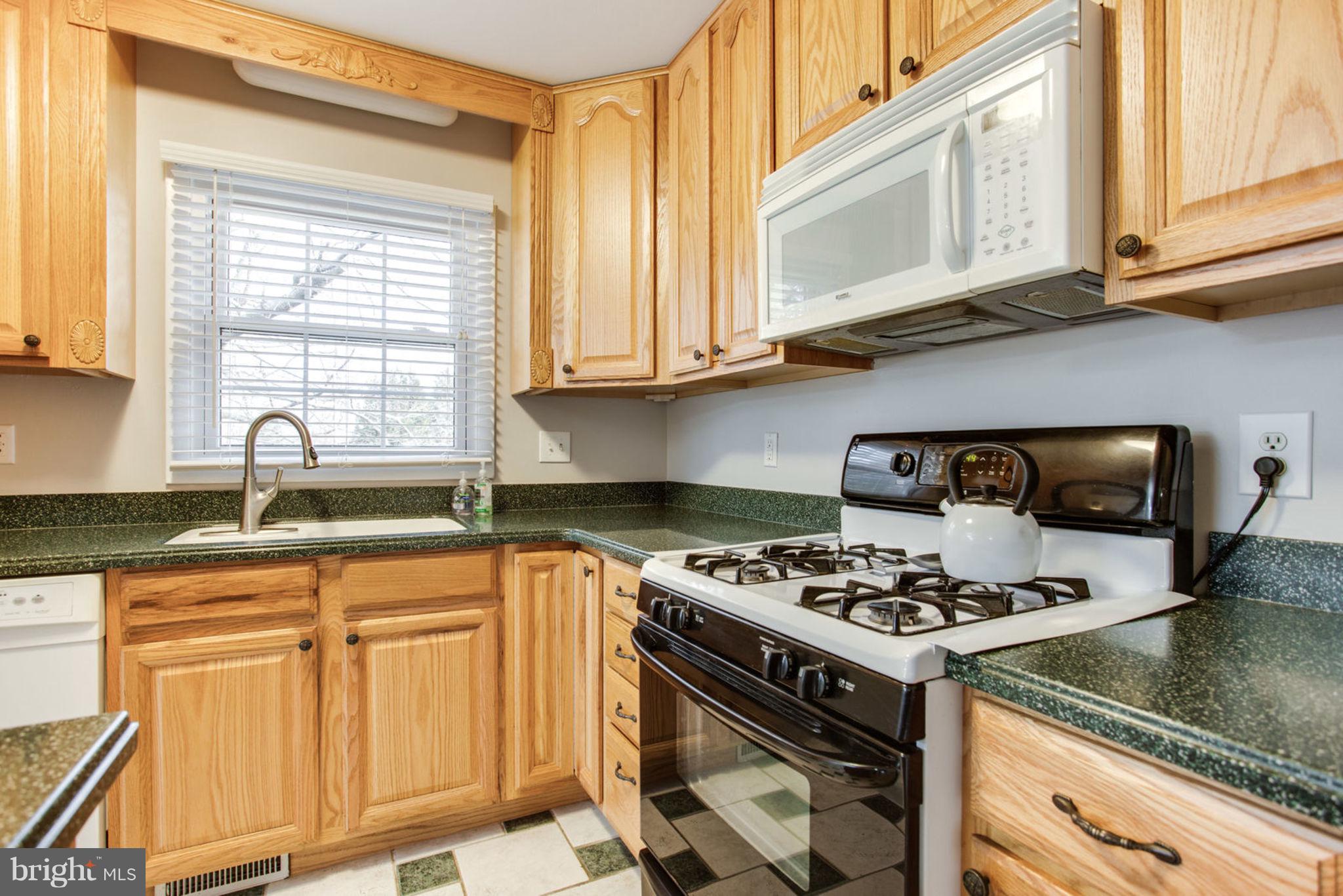 1625 Thomas Drive Point of Rocks, MD 21777 - Photo 20 of 47 a kitchen with stainless steel appliances granite countertop a stove a sink and a microwave