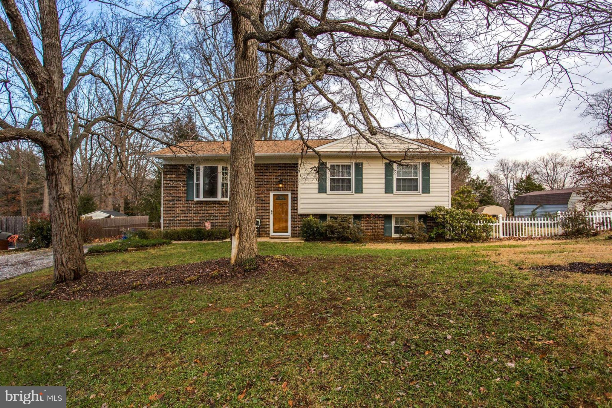 1625 Thomas Drive Point of Rocks, MD 21777 - Photo 3 of 47 a house that has a tree in front of the house