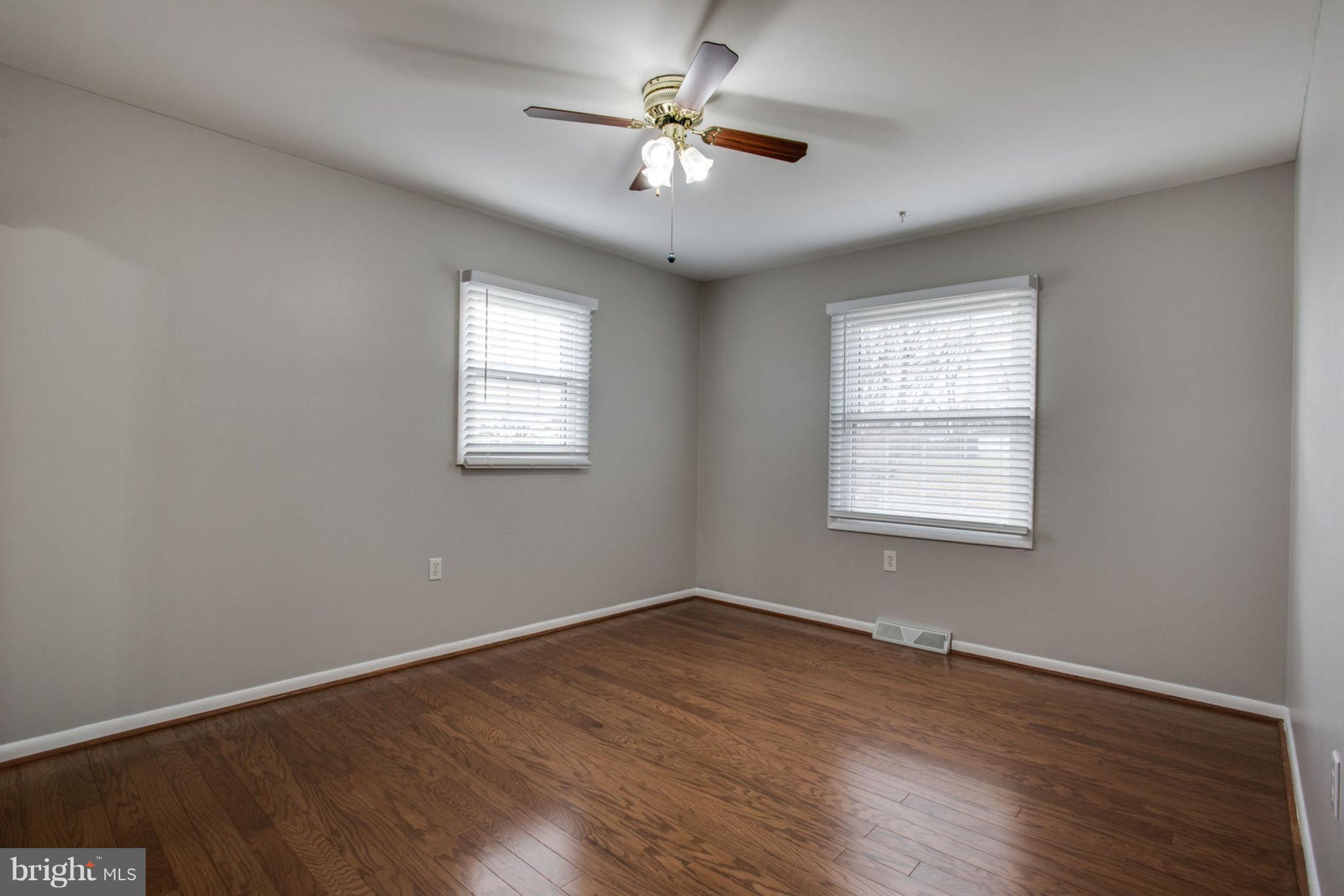 1625 Thomas Drive Point of Rocks, MD 21777 - Photo 22 of 47 an empty room with wooden floor and windows