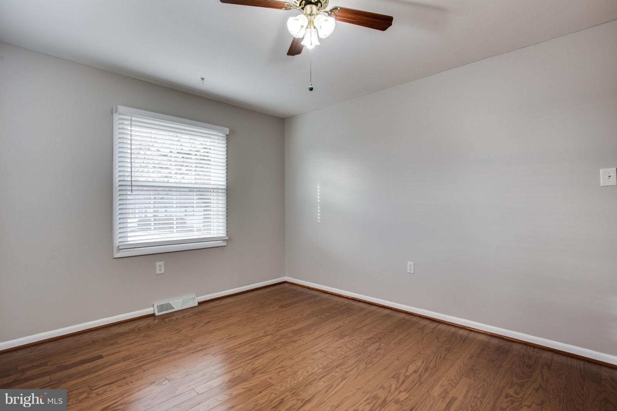 1625 Thomas Drive Point of Rocks, MD 21777 - Photo 23 of 47 wooden floor in an empty room with a window